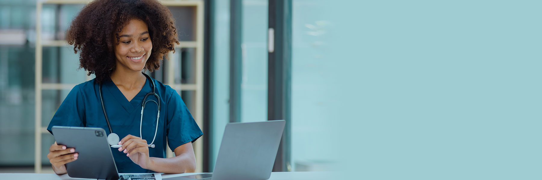 NWVNA nurse entering patient information on laptop
